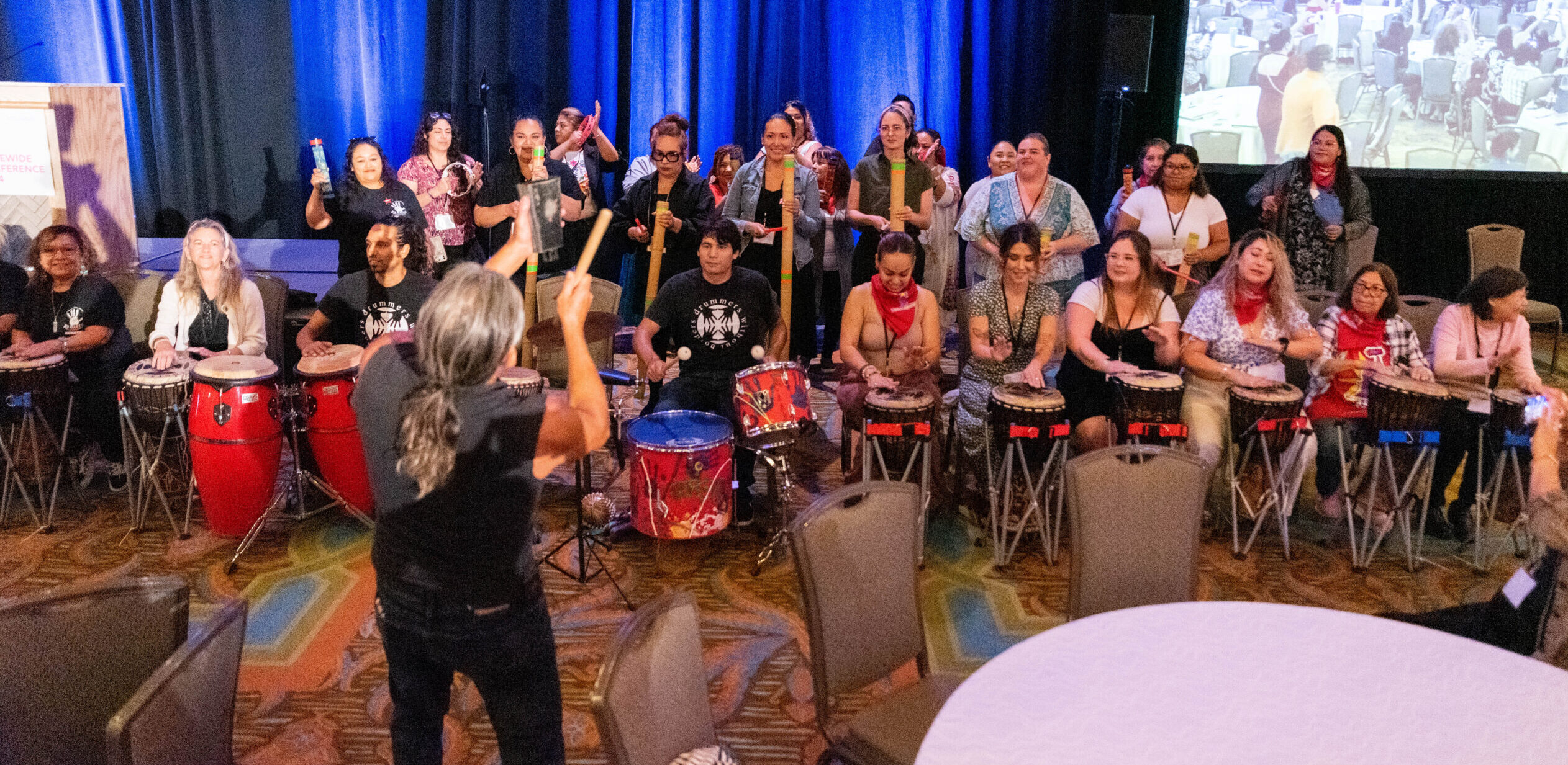 Photo of a group of people playing various instruments. 